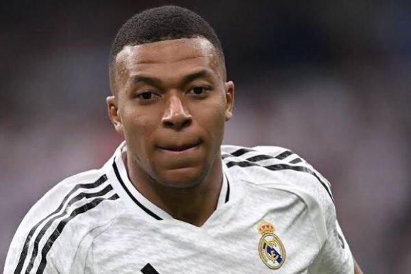 Kylian Mbappé celebrating a goal during a Real Madrid football match.