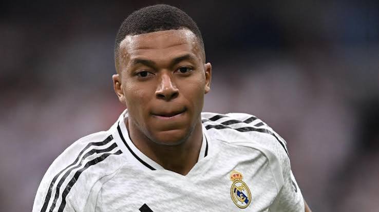 Kylian Mbappé celebrating a goal during a Real Madrid football match.